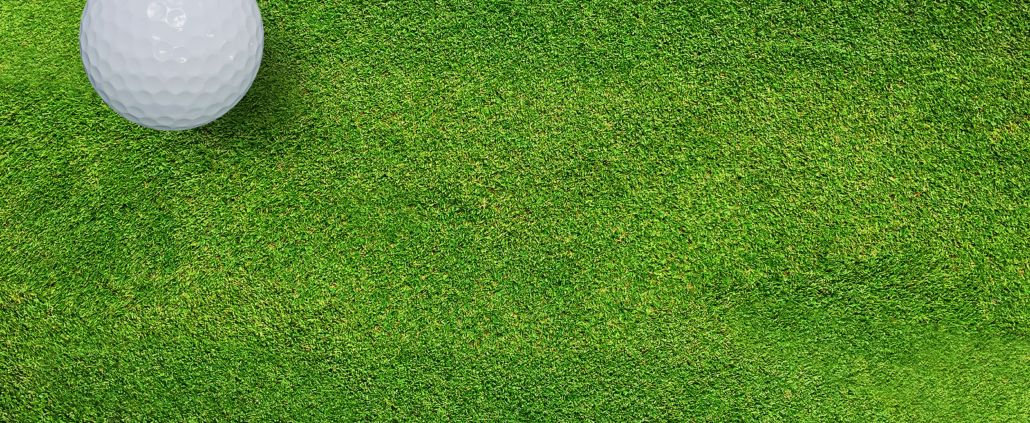 Golf ball on green grass of golf course - River Oaks Golf Course - Cottage Grove