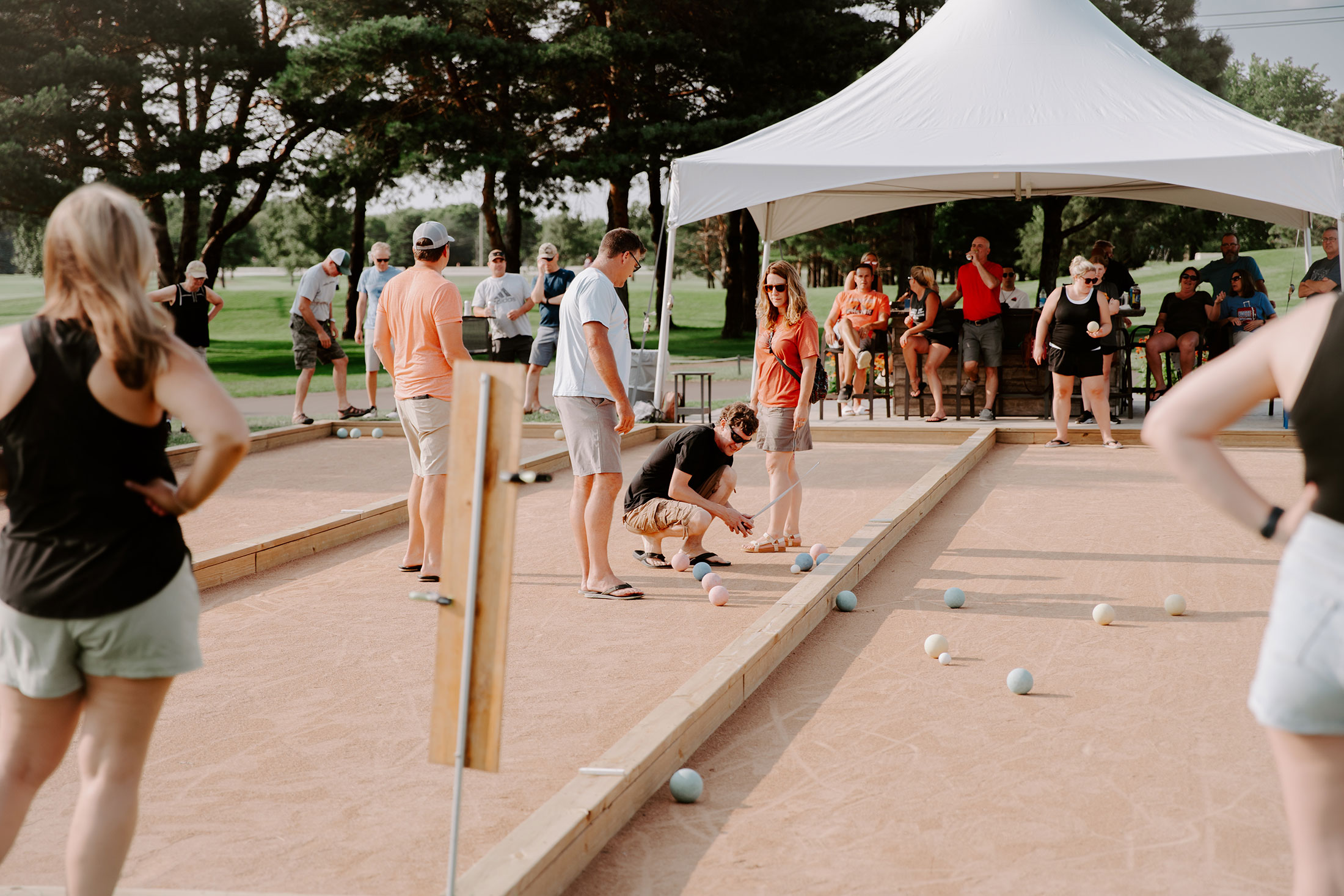 Guests playing bocce during outdoor event – company holiday event space