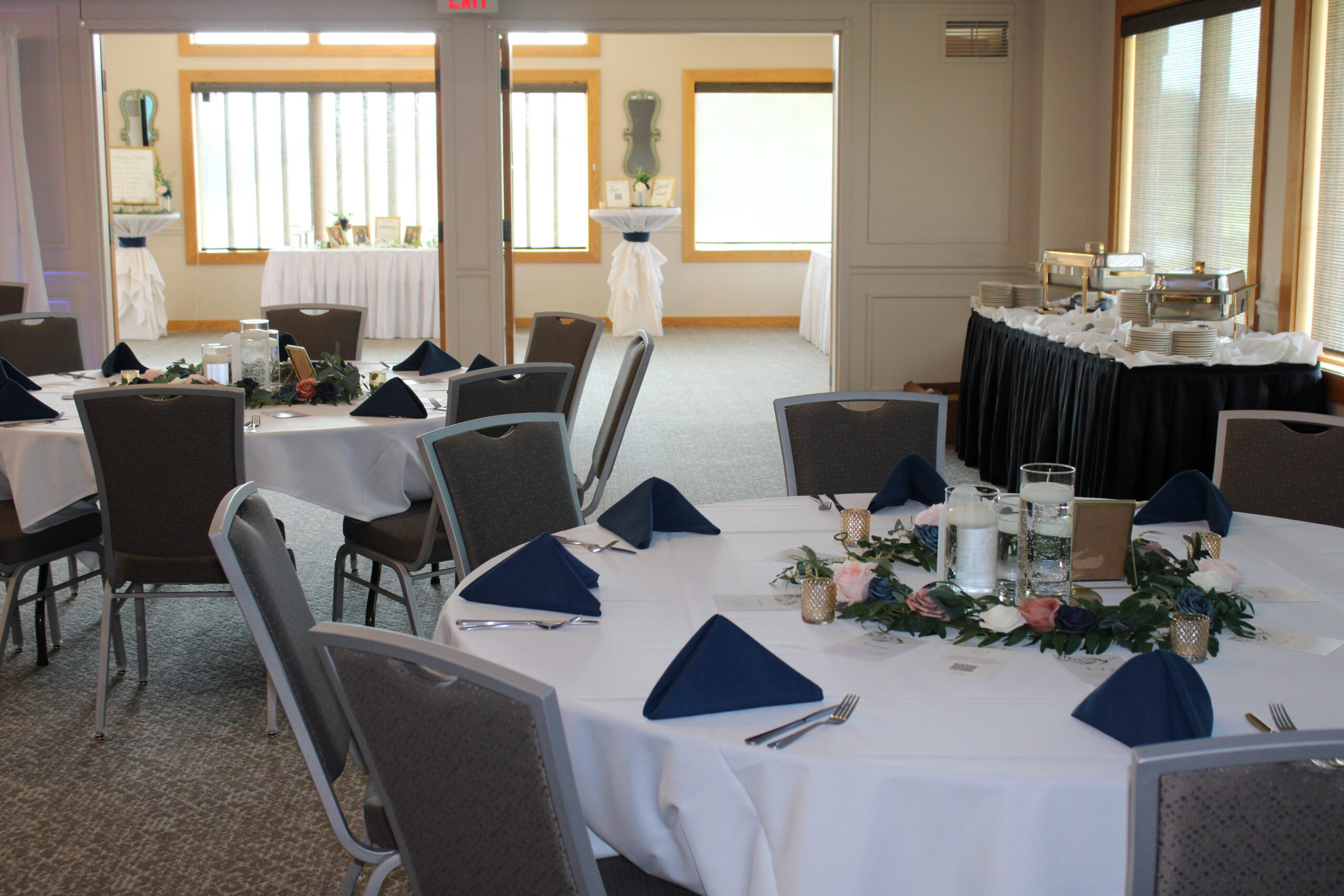 Indoor event space with banquet tables and wedding reception setup at River Oaks Golf Course and Event Center in Cottage Grove Minnesota